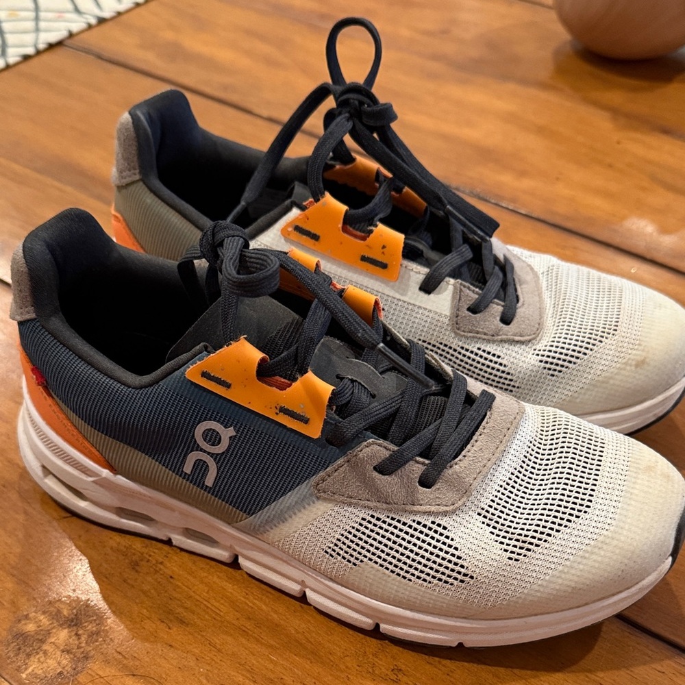 On Running Cream and Orange Athletic Shoes